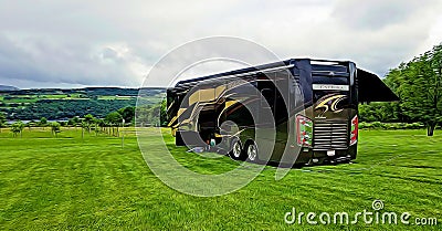 3D illustration of a luxurious Entegra motorhome at a field during a family vacation travel Cartoon Illustration