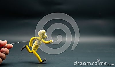 Process of running stopmotion. Running with style and placidly. Man's hand holding with aluminum wire a figure Stock Photo