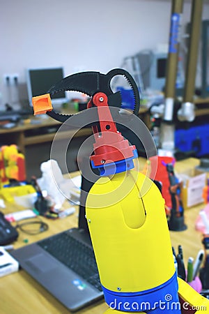 3D printed robot clamp, holder. Plastic manipulator, robotic hand machine tool printed on three dimensional printer. DIY Stock Photo