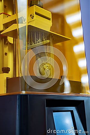 3d printer in action, vertical shot. Stock Photo