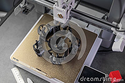 3D printer prints an object. The process of printing model on 3D printer. Model printed on 3D printer from molten Stock Photo
