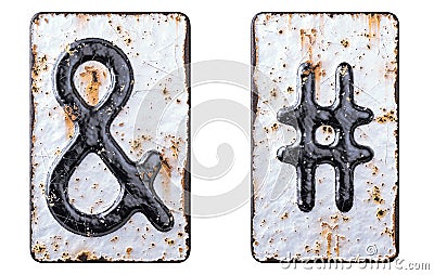 Set of symbols ampersand and hash made of forged metal on the background fragment of a metal surface with cracked rust. Stock Photo