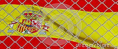 Spanish flag behind steel mesh wire fence. the flag of spain Stock Photo