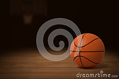 3d rendering of a basketball on the wooden floor of a dimly lit gym. Stock Photo