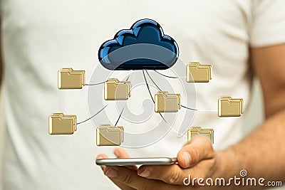 3d rendering of beige computer folders connected to a blue data cloud over a smartphone in a hand Stock Photo