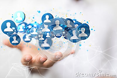 3D rendering of a businessman pointing at a group of blue people icons Stock Photo