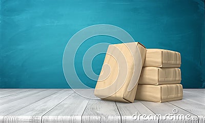 3d rendering of a cement bag leaning over three other stacked packs on a wooden table on blue background. Stock Photo