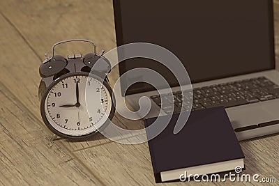 3D rendering of a clock, laptop and book for studies for works Stock Photo