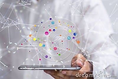 3D rendering of a colorful communication blockchain floating above a tablet Stock Photo