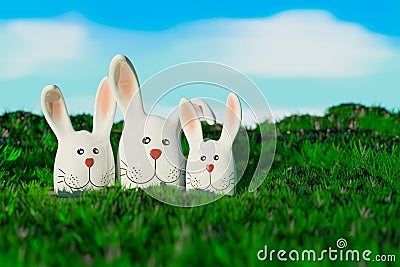 the cute adorable trio bunny on a green grass field outdoors, the concept for easter festival Stock Photo