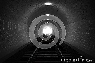 3d rendering of darken train tunnel with light at the end Stock Photo