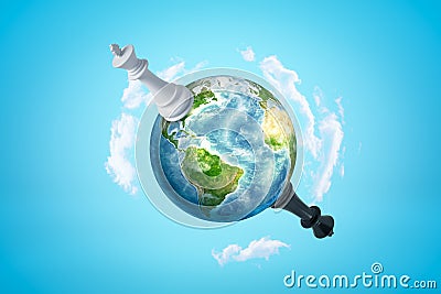 3d rendering of Earth in blue sky, with huge black and white chess kings on opposite sides of planet. Stock Photo