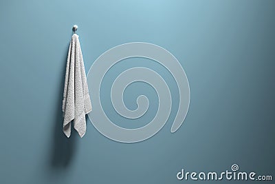 3D rendering : illustration of a piece of clean and white towel hanging on a blue pastel wall,light and shadow,copy space Cartoon Illustration