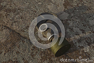 lying gas mask on stone surface Stock Photo