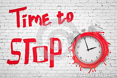 3d rendering of melting red alarm clock smashed into white brick wall with title `Time to STOP`. Stock Photo