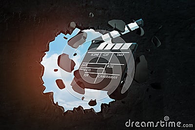 3d rendering of movie clapper breaking black wall Stock Photo