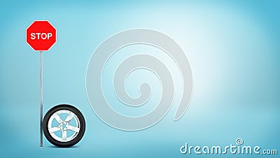 3d rendering of one car chrome wheel standing on its rim beside a `STOP` red road sign. Stock Photo