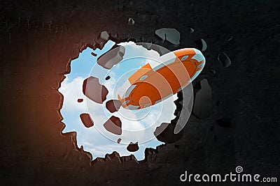 3d rendering of orange casino token breaking through black wall Stock Photo