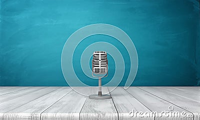 3d rendering of a single metal retro microphone placed on its short stand over a wooden desk. Stock Photo