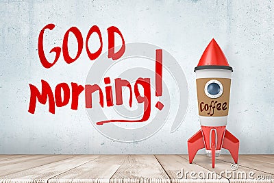 3d rendering of toy rocket made of coffee paper cup, standing on wooden floor, near wall with title `Good Morning` Stock Photo