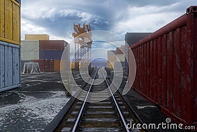 3D rendering of a train track through a generic shipping container yard in docklands Cartoon Illustration