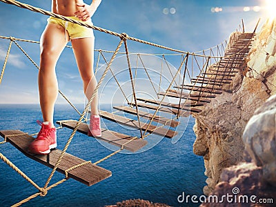 3D Rendering of trip on a crumbling bridge Stock Photo