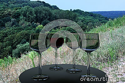 3D rendering of wine glasses and a real world picture of trees on a sunny day Stock Photo
