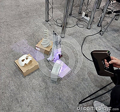 3D scanning. Working portable 3D scanner. Man scanning an object Stock Photo