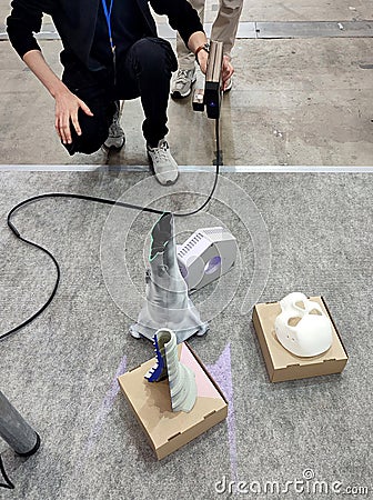 3D scanning. Working portable 3D scanner. Man scanning an object Stock Photo