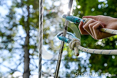 D shape carabine climbing equipment providing safety in extreme park Stock Photo