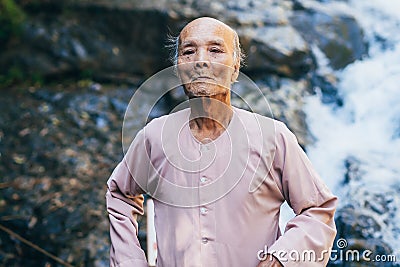 DA LAT, VIETNAM - MARCH 9, 2017: Portrait of an elderly Vietnamese octogenarian in the Park Editorial Stock Photo