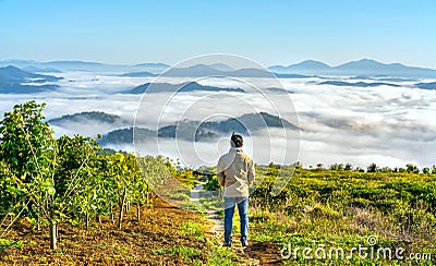 Silhouette young man standing on a high hill scenic rural hometown Editorial Stock Photo