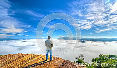 Silhouette young man standing on a high hill scenic rural hometown Editorial Stock Photo