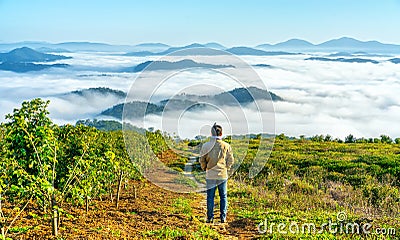 Silhouette young man standing on a high hill scenic rural hometown Editorial Stock Photo