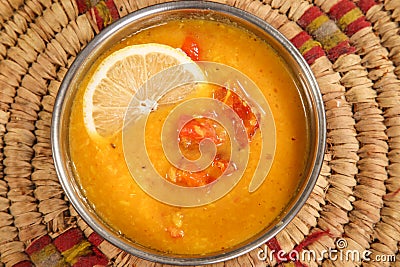 Daal lentil Soup with lemon served in bowl isolated on background top view arabic style Stock Photo