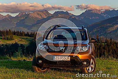 Dacia Duster SUV in the mountain wilderness during sunset Editorial Stock Photo