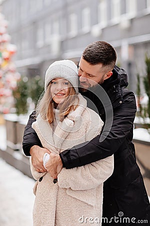 Dad and daughter teenager walk the winter streets. Father's Day. Stock Photo