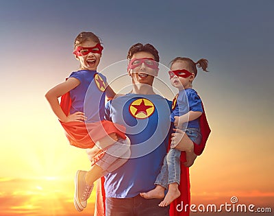 Dad and his daughters are playing Stock Photo