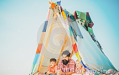 Dad with kids playing together in tent. Summer outdoor. Family playing together. Happy father with chidren, camping Stock Photo