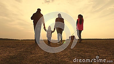 Dad, Mom, a small child and daughters and pets tourists. teamwork of a close-knit family. family travels with the dog on. Dad, Mom, small child and daughters and stock video footage Dad, Mom, a small child and daughters and pets tourists. teamwork of a close-knit family. family travels with the dog on. Dad, Mom, small child and daughters and stock video footage