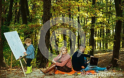 Dad mom and son playing together. Family Camping with kids. We like autumn time together. Happy family having fun in Stock Photo