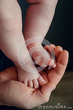 Dad, skin, foot, man, newborn, small, father, family, parent, hand, life, child, care, love, baby, cute, leg, kid Stock Photo