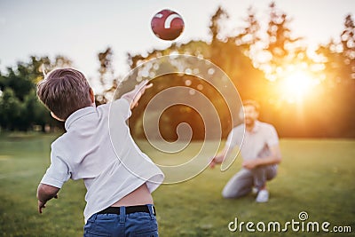 Dad with son playing baseball Stock Photo