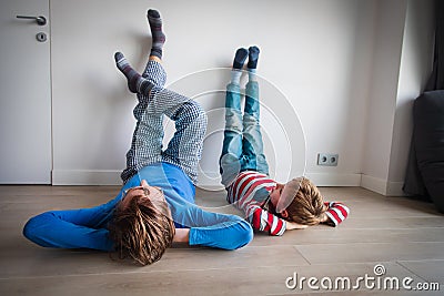 Dad and son relax at home, comfort and family time Stock Photo