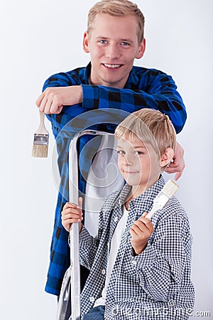 Dad and son renovating house Stock Photo