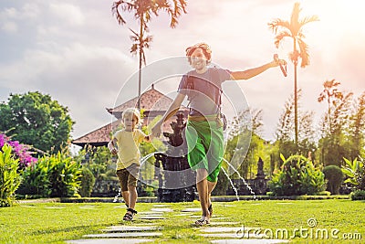 Dad and son tourists in Traditional balinese hindu Temple Taman Ayun in Mengwi. Bali, Indonesia. Traveling with children concept w Stock Photo