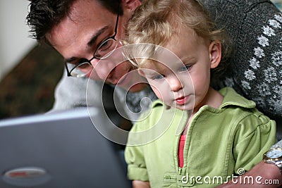 Daddy and Baby at Computer Stock Photo