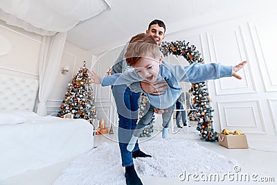 A daddy with his tree hugging and having fun. love, happiness and big family concept Stock Photo