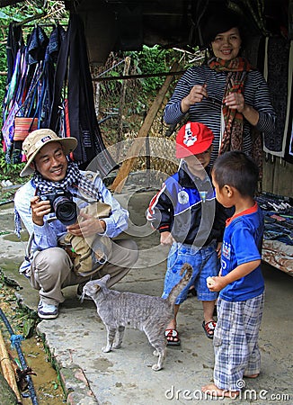 Daddy, mom and two sons are walking in tourist Editorial Stock Photo