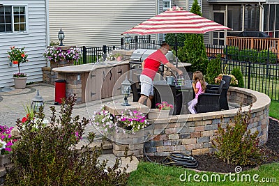 Daddy serving lemonade to his little daughter Stock Photo